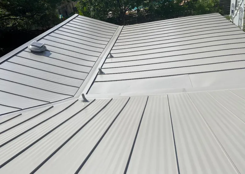 Solar attic fan installed on a metal roof for Roof Ventilation in Dowagiac